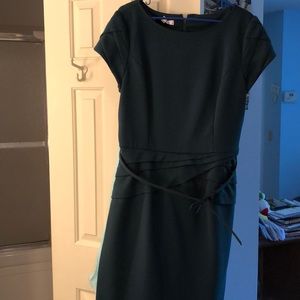 Dark green dress with peplum